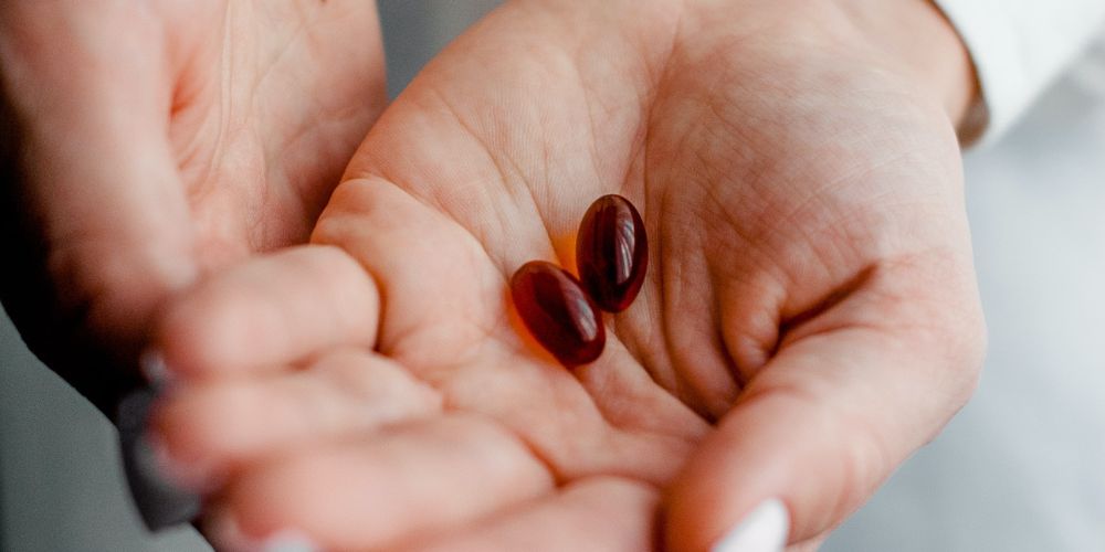 photo of a hand holding a medicine