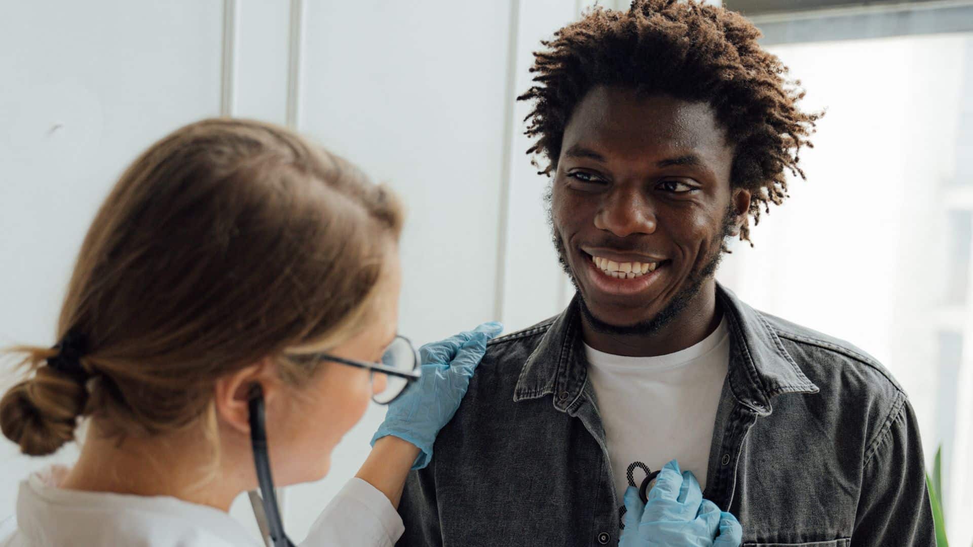 photo of a medical professional checking the heart rate of the client