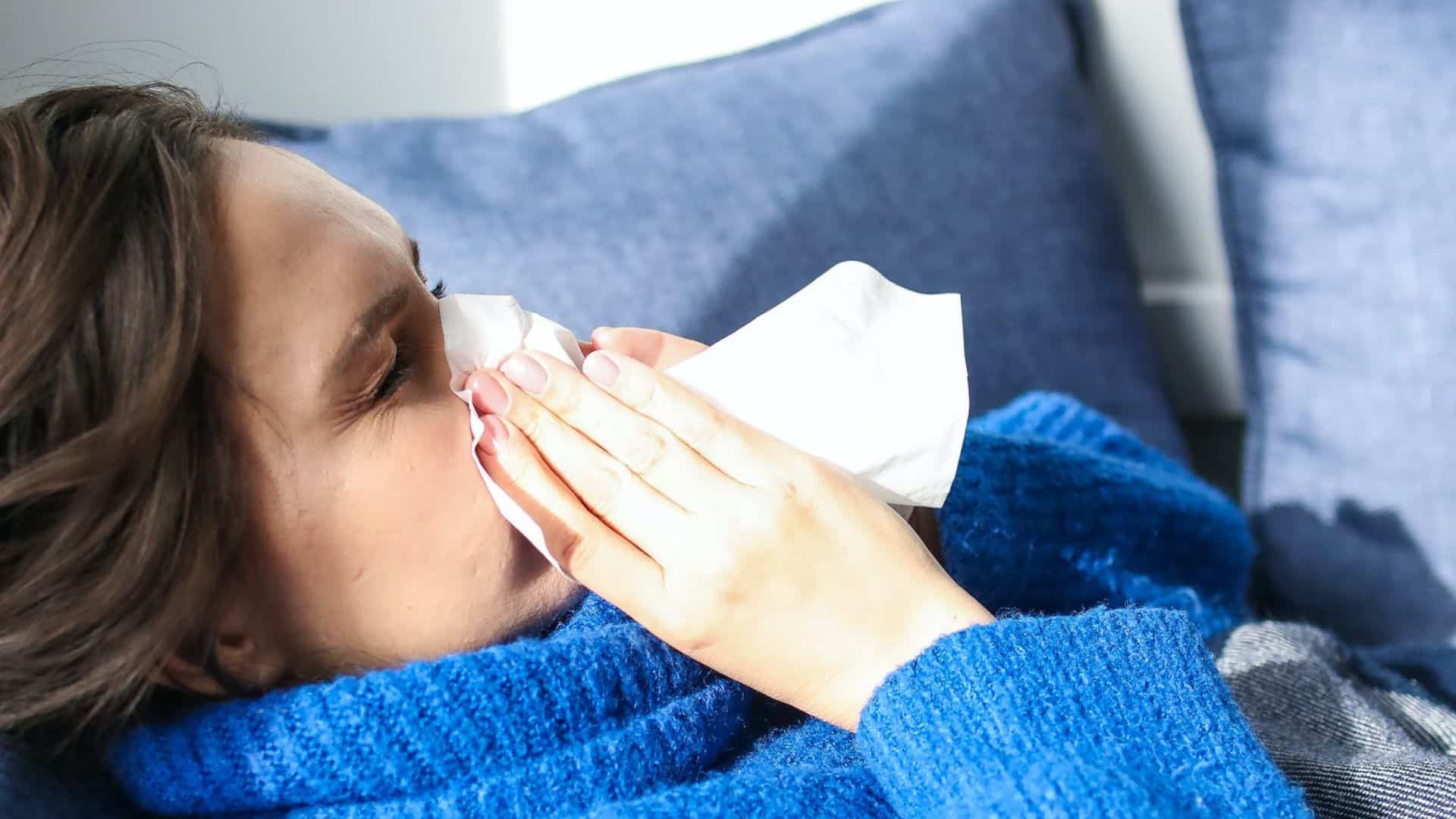 photo of a woman experiencing flu-like feeling