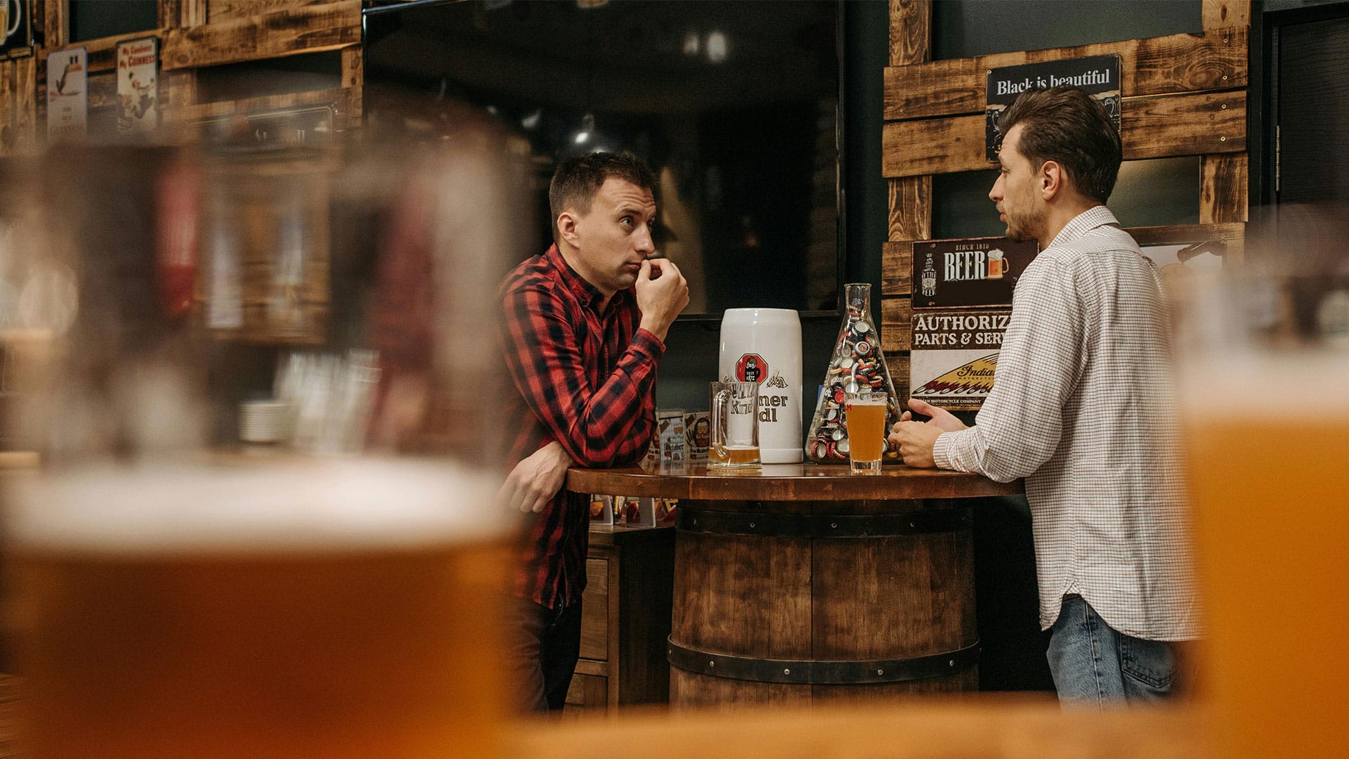 men hanging out at a bar