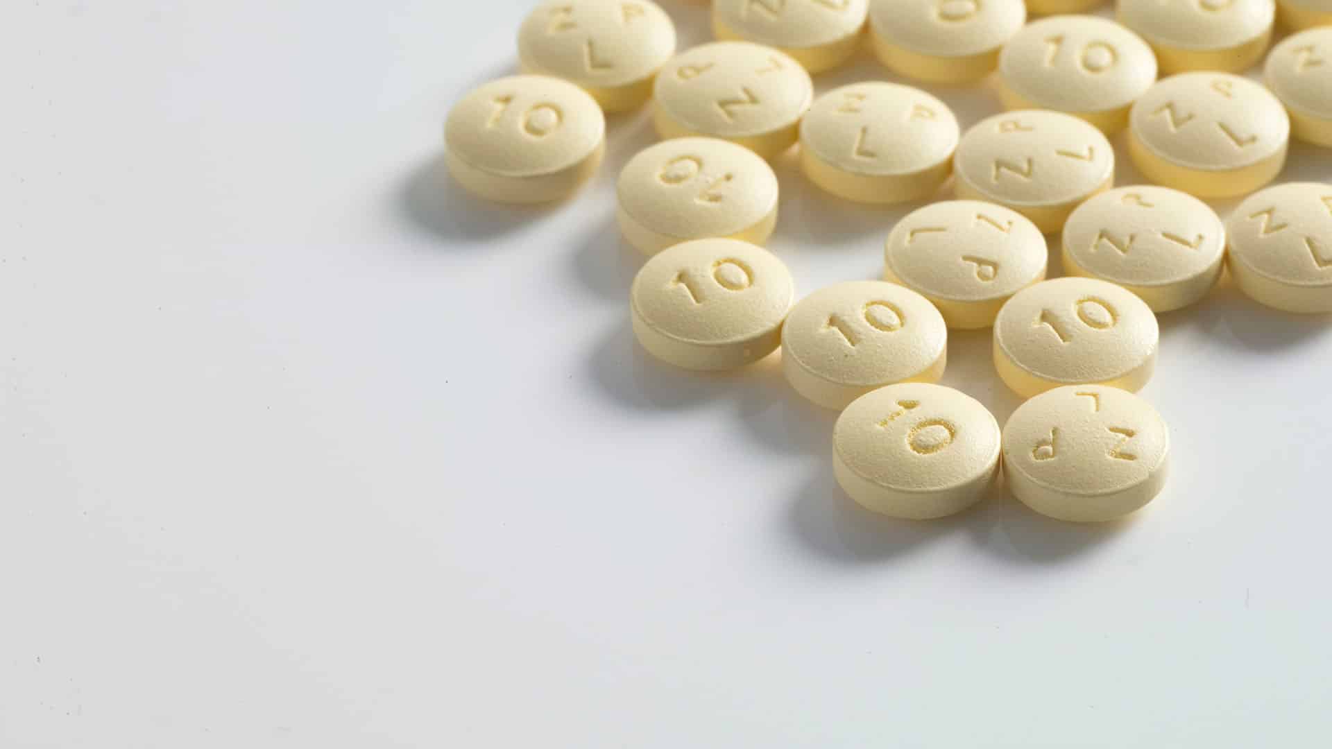 round yellow medication pill