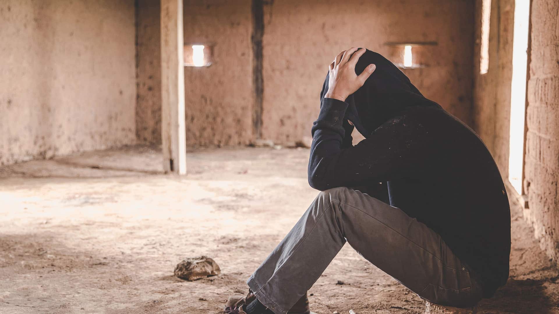 a stressed young man is worried because he is using drugs