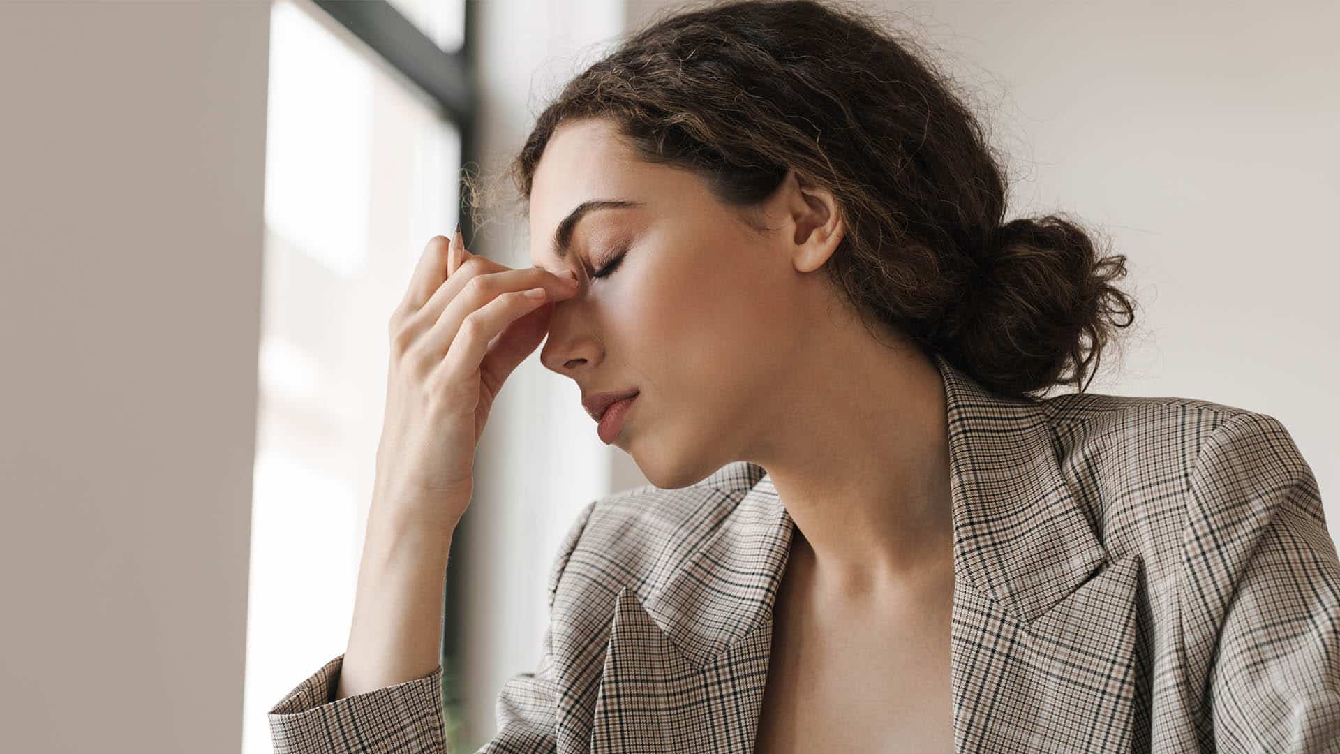 tired brunette woman working